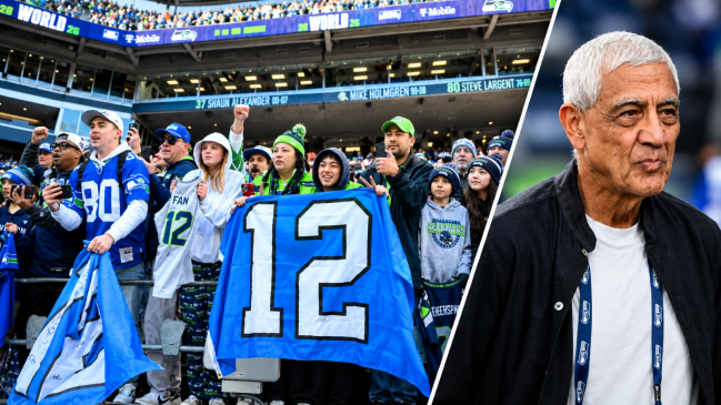 Seattle Seahawks fans hold up a flag before the Super Bowl LX trophy presentation at Lumen Field. Seattle Seahawks owner Vinod Khosla looks on from the sideline in the second half of the game against the Arizona Cardinals at State Farm Stadium. 
