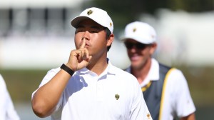 Sep 26, 2026; Medinah, Illinois, USA; Tom Kim of the International Team reacts towards the gallery after playing partner Si Woo Kim makes a birdie to win the 16th hole during the third round of the Presidents Cup.