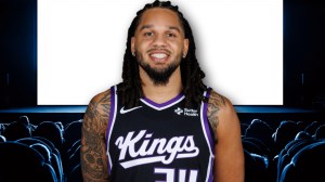 Sacramento Kings rookie Emanuel Sharp in front of screen at a movie theater