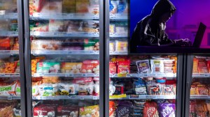 ominous image of a hacker next to a grocery store freezer aisle