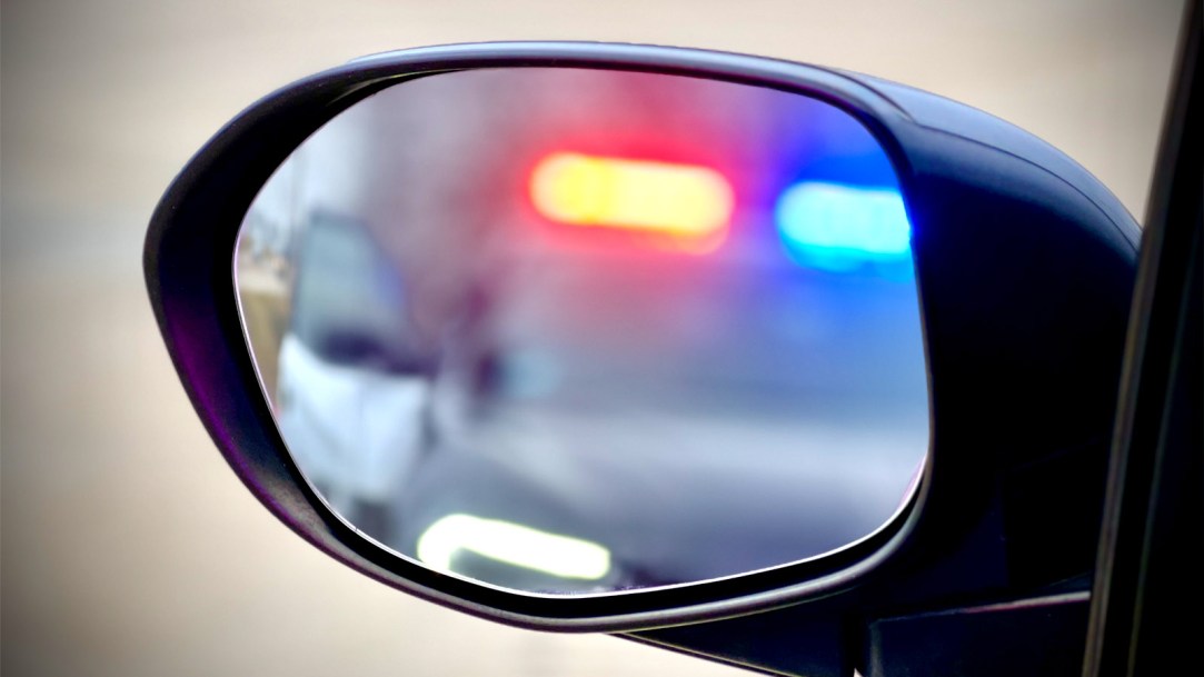 police-car-in-rear-view-mirror